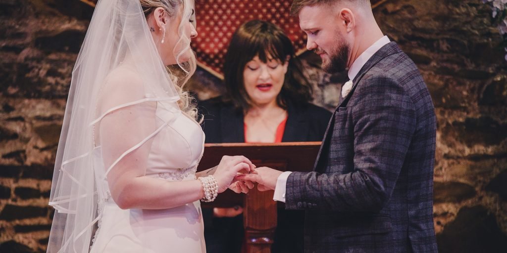 A bride and groom exchanging their vows in a church.