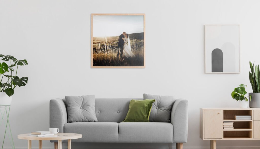 Family Photographer A living room with a picture in a beautiful frame design of a woman in a field.